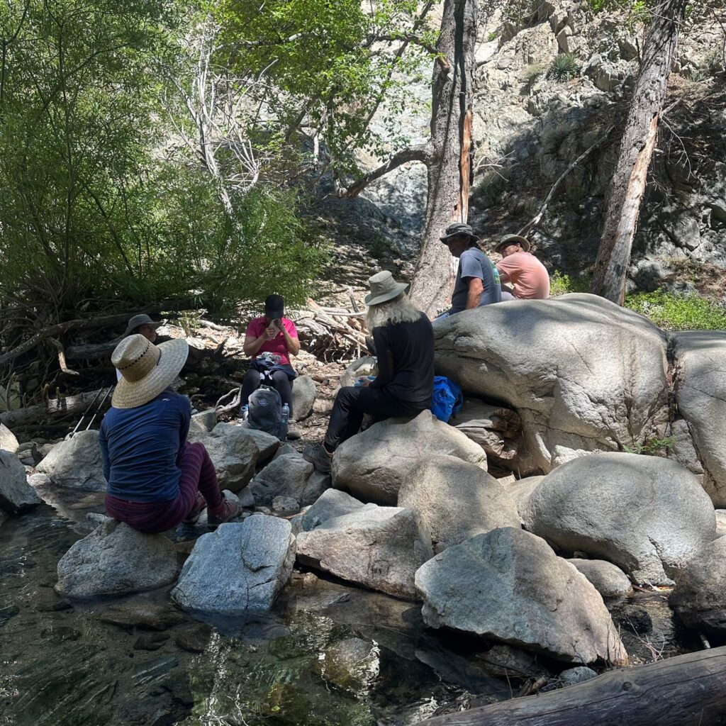 Benefits of Hiking, hiking group stopping for lunch and conversation